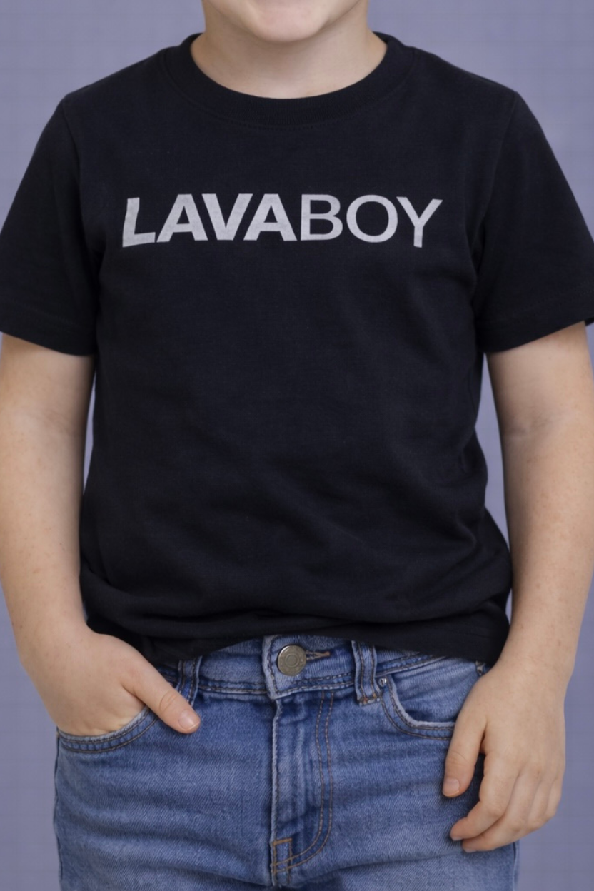 Boy wearing a black shirt with LAVABOY on front.
