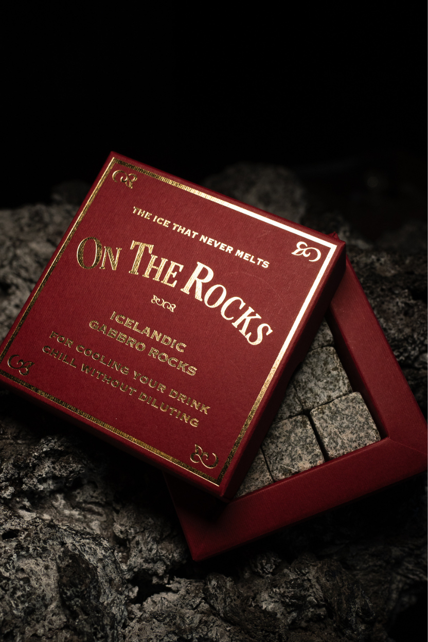 Red box labeled 'On The Rocks' on a dark stone surface
